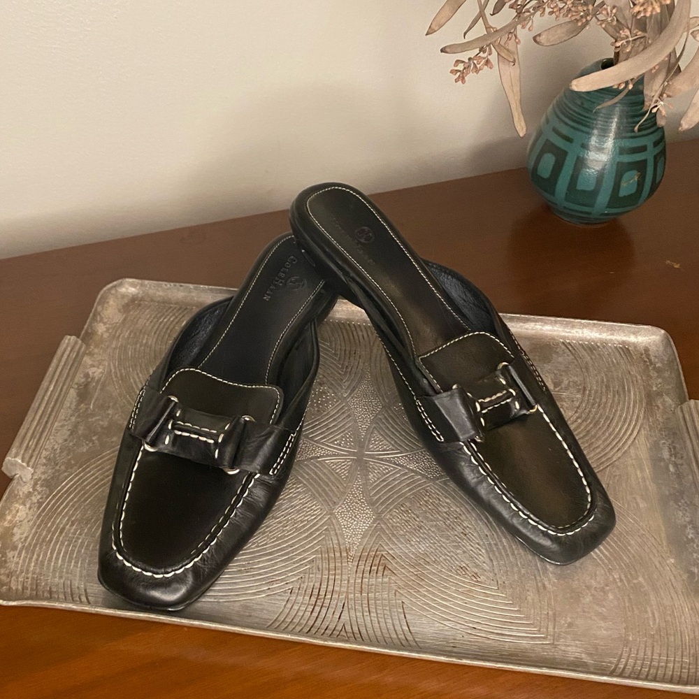 Black leather Cole Haan loafer mules with contrast stitching